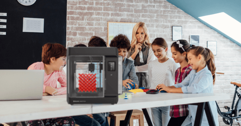 students using a 3d printer for MakerEd activities in the library makerspace