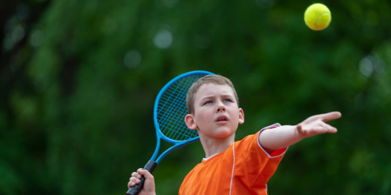 student playing tennis with STEM sports